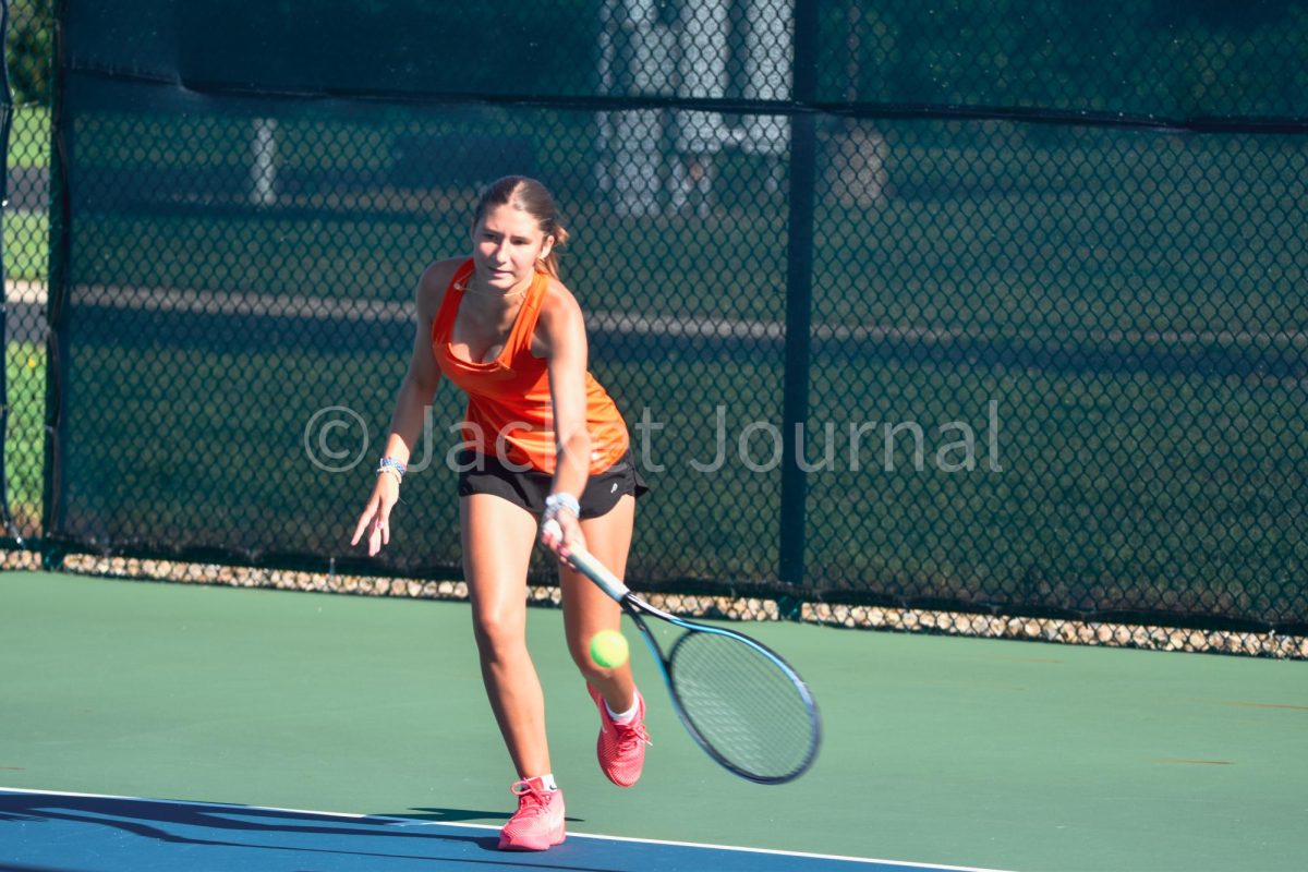 Mount Vernon hosts their annual tennis tournament. Junior Cameron Carlson attacks the ball.