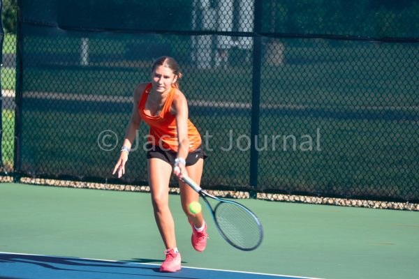 Mount Vernon hosts their annual tennis tournament. Junior Cameron Carlson attacks the ball.