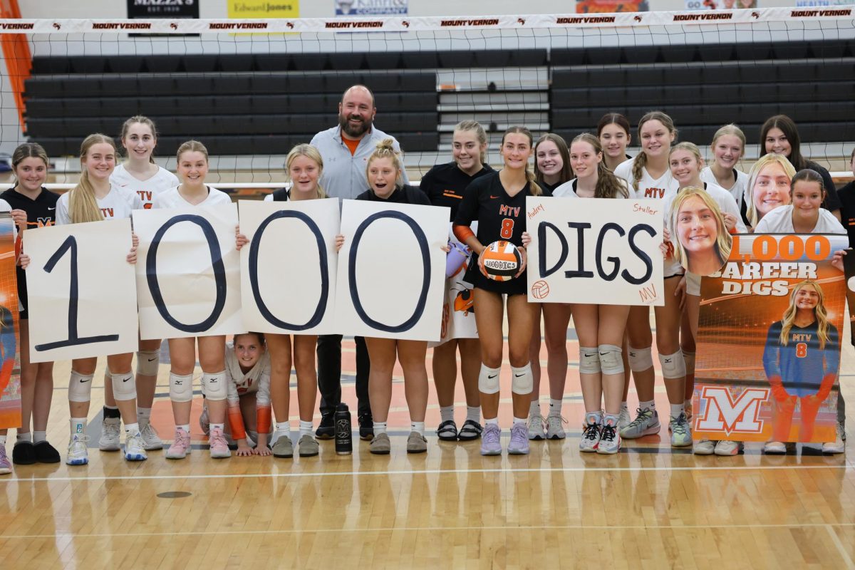 Audrey Stuller celebrates her 1000 dig