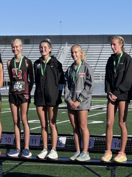 Lucy Rush stands on the podium as she is headed to the State Tournament on November 2