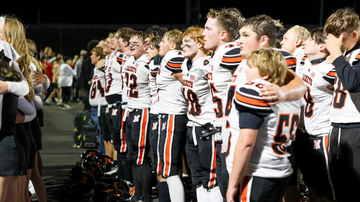 The Jackets sing the alma mater after the victory