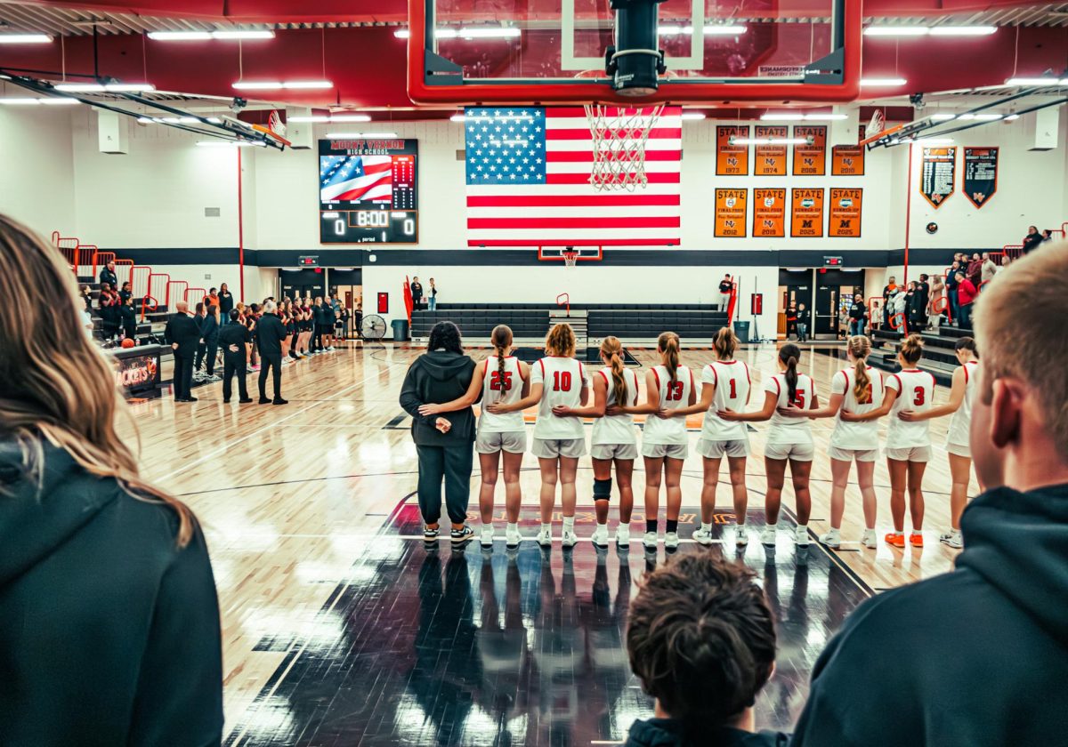 A moment of unity as everyone comes together for the national anthem